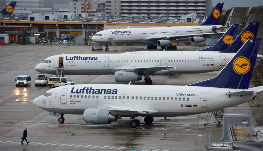FRANKFURT AM MAIN, GERMANY - OCTOBER 21:  A man walkes in front of Lufthansa airplanes at the Frankfurt Airport on October 21, 2014 in Frankfurt am Main, Germany. Vereinigung Cockpit, the labor union that represents the pilots, launched the two-day strike yesterday that has been expanded from short and medium-distance flights on the first day to long haul flights today, affecting over 100,000 passengers. This is the seventh strike by Lufthansa and Germanwings (a Lufthansa subsidiary) pilots this year as the union attempts to maintain the Lufthansa pilots' early retirement guarantee, a benefit that Lufthansa is trying to cut.  (Photo by Thomas Lohnes/Getty Images)